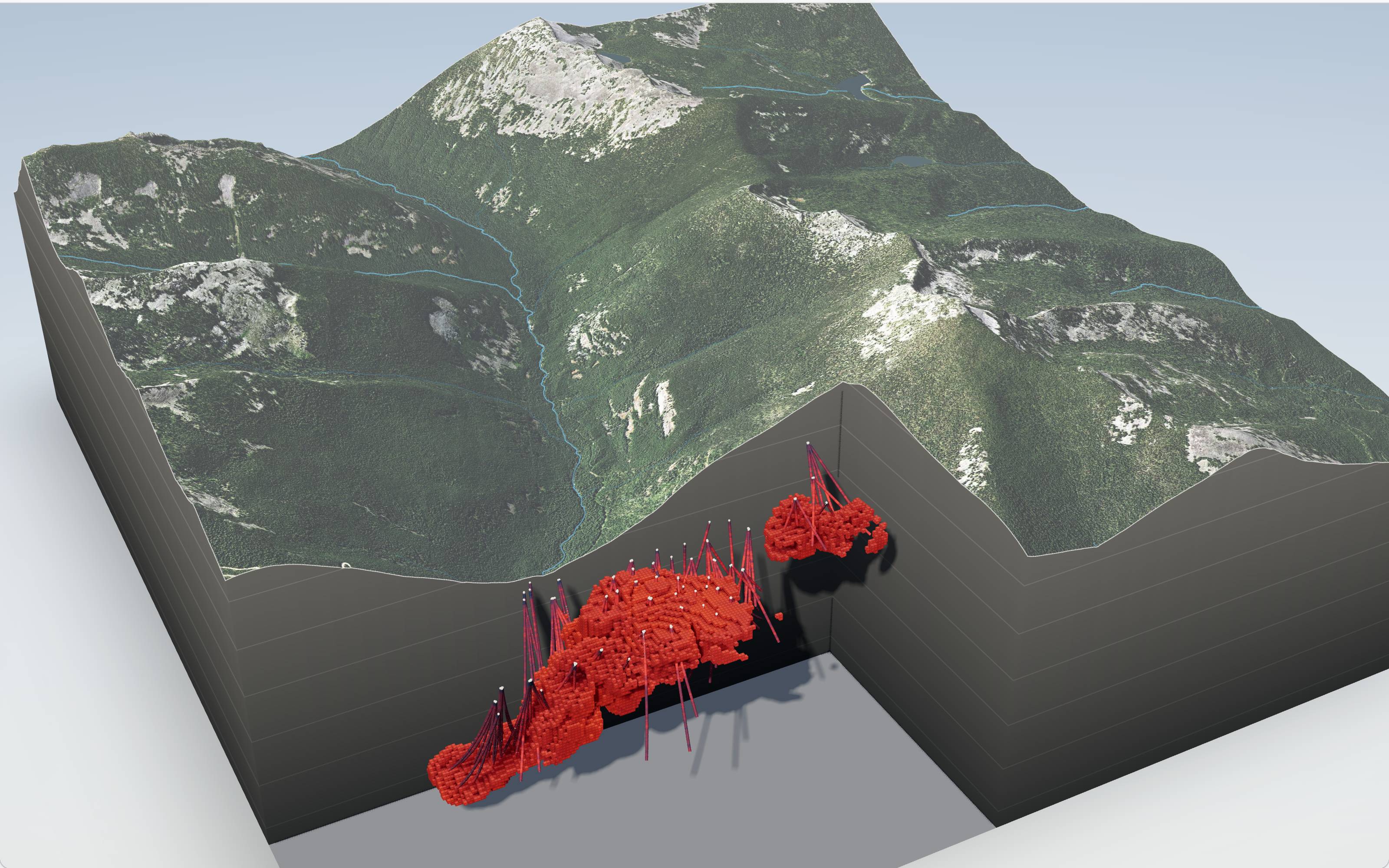 A cutaway of an illustrative property: the copper block model and its drill holes stand in a corner cut from the ground, with aerial imagery draped over the relief, a forested spur, two creeks and granite alpine behind.